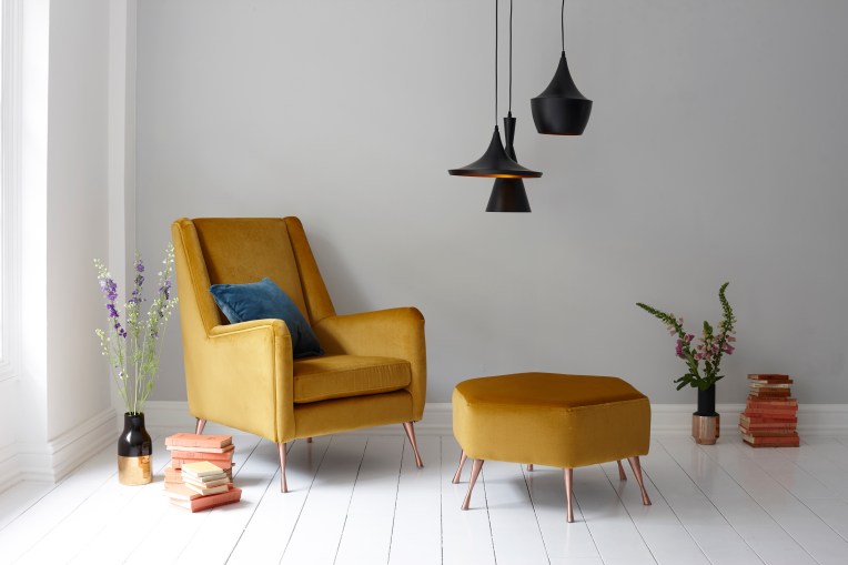 Mustard velvet armchair with footstool. Interior photography by Joanna Henderson