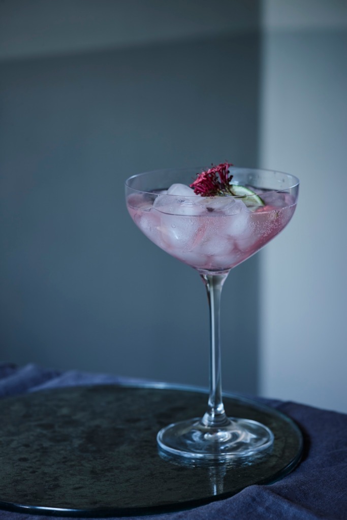 Pink cocktail served in a cocktail glass 